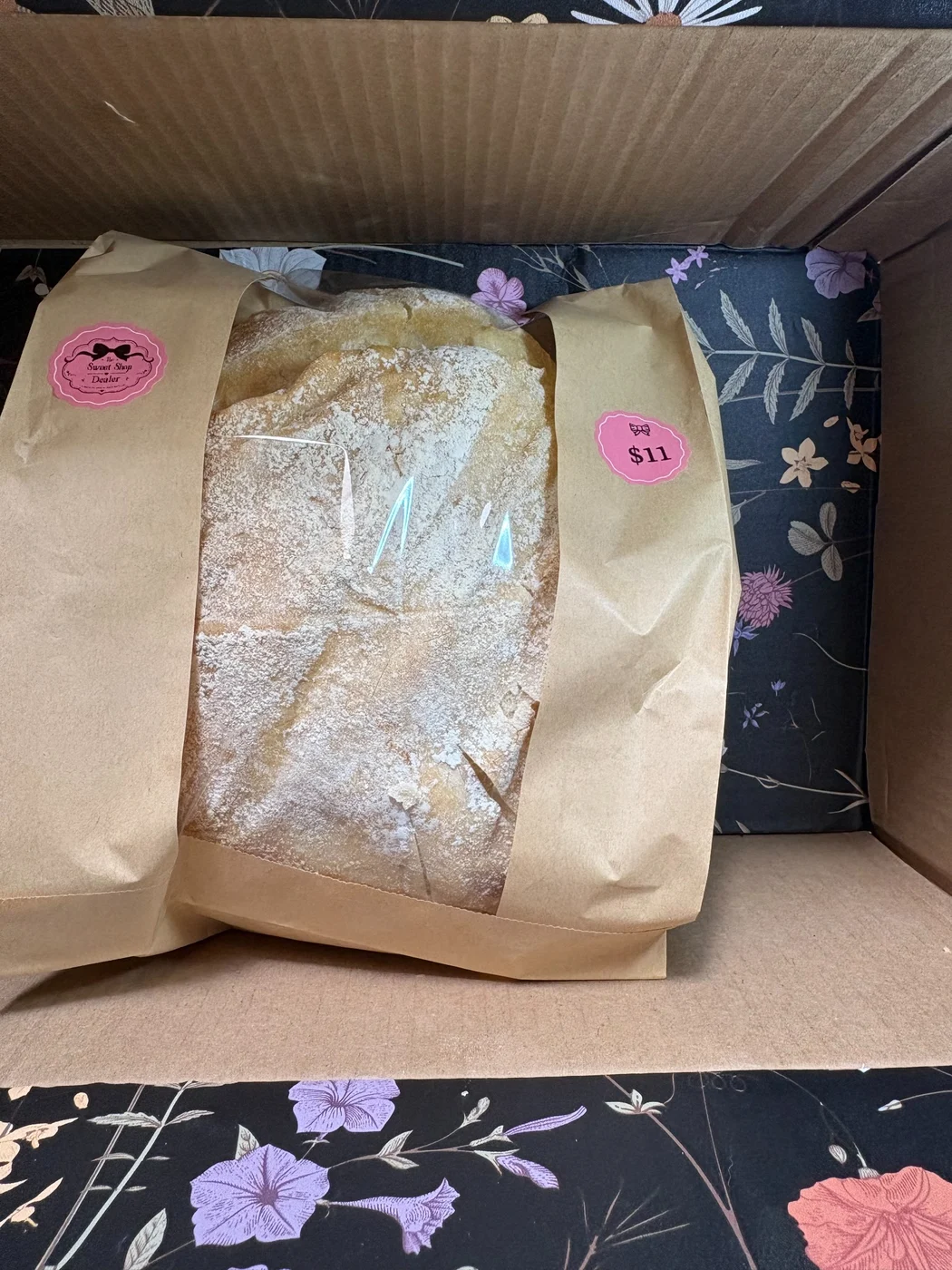 Powdered treats in a window bag with a pink Sweet Shop Dealer sticker.